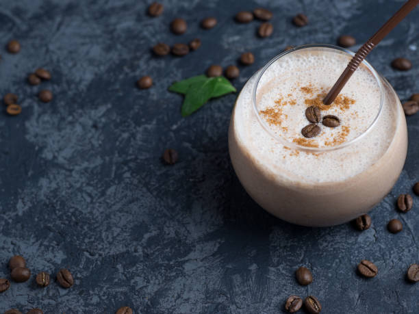 istock Chocolate coffee smoothie in a glass on a concrete table with copyspace 1160975521