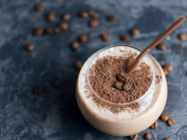 istock Chocolate coffee smoothie in a glass on a concrete table with copyspace 1160975523