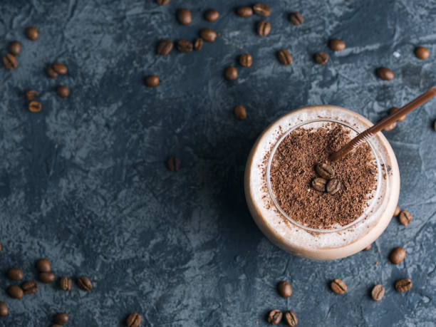 istock Chocolate coffee smoothie in a glass on a concrete table with copyspace 1160975527