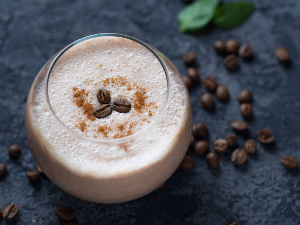 istock Coffee smoothie with chocolate and milk on a concrete table close-up 1160975643