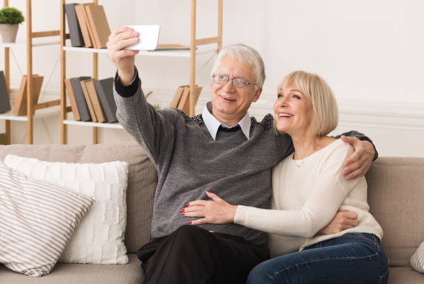 istock Elderly couple making video call from smartphone 1160976568