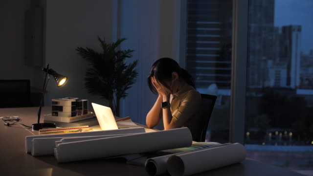 Woman Working Late untill morning in office, Hard working