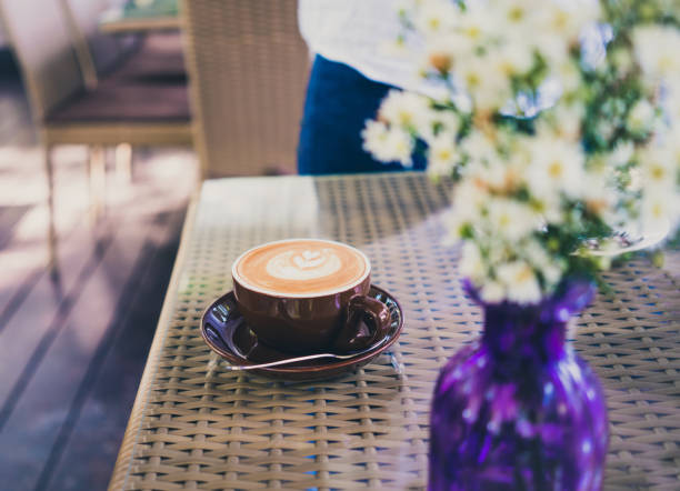 cups of cappuccino with latte art  on table in coffee shop.
