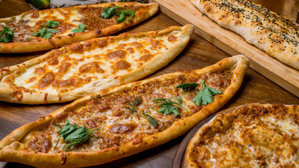 Turkish pide with meat on the board stock photo