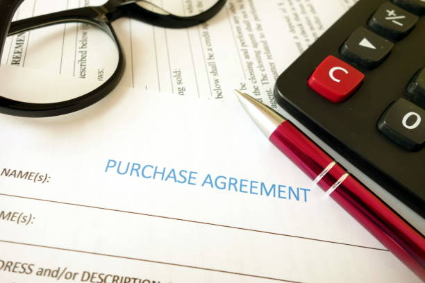 istock Purchase agreement for filling with pen calculator and glasses 1160978075