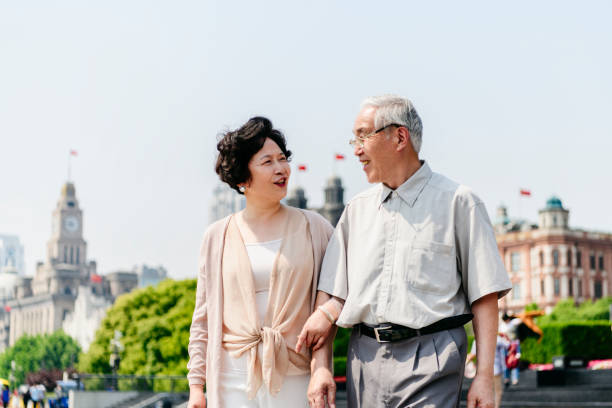 istock Active Senior Chinese Couple Enjoying a Walk Along The Bund 1160979634