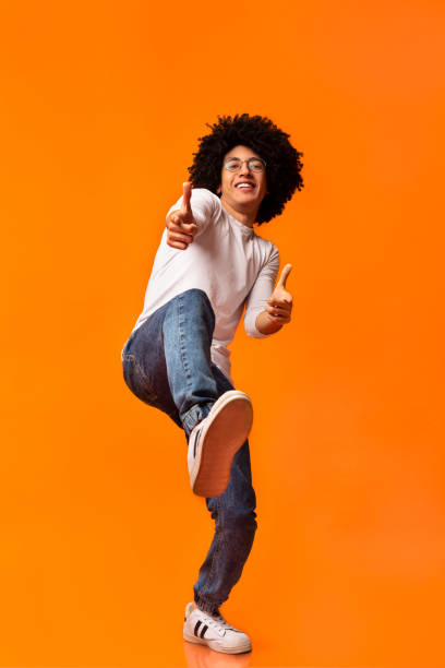 istock Cheerful man in spectacle indicating happily at you 1160982646