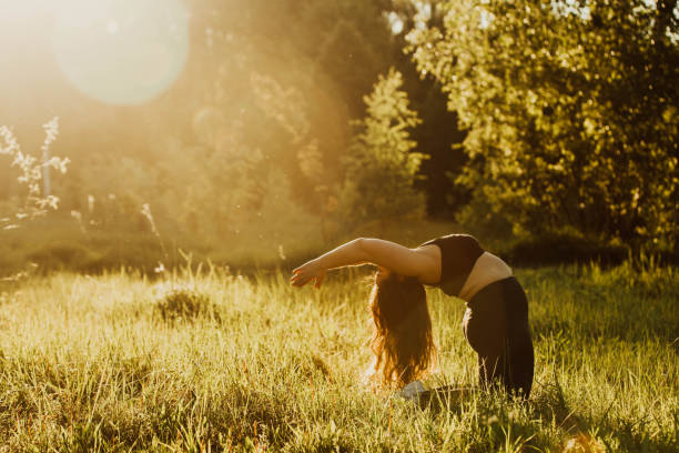istock Plus size girl doing yoga in nature. 1160982872