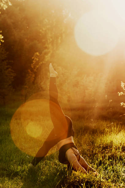 istock Plus size girl doing yoga in nature. 1160982876