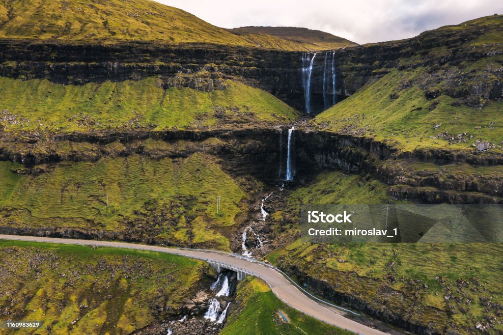 Aerial view of the Fossa Waterfall on island Bordoy in the Faroe Islands Aerial view of the Fossa Waterfall on island Bordoy. This is the highest waterfall in the Faroe Islands, situated in wild scandinavian scenery. Aerial View Stock Photo