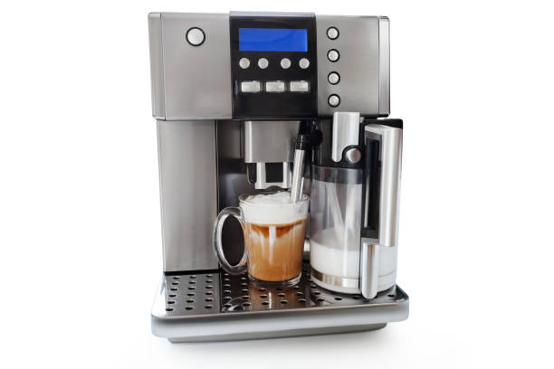 istock automatic coffee maker with cup of coffee and milk jug 1160984491