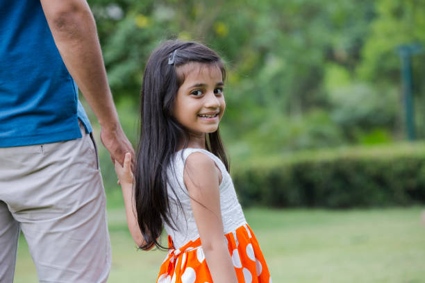 Adult man and baby girl are happy and with great rapport