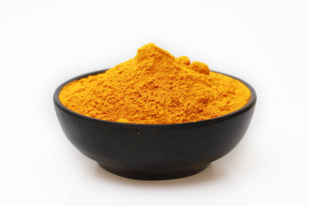 istock Turmeric powder on white background 1160987424