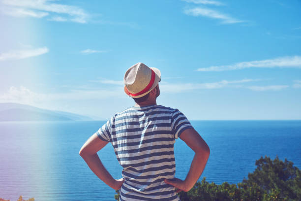 istock Attractive man enjoying on the tropical beach. Summer concept. 1160991364