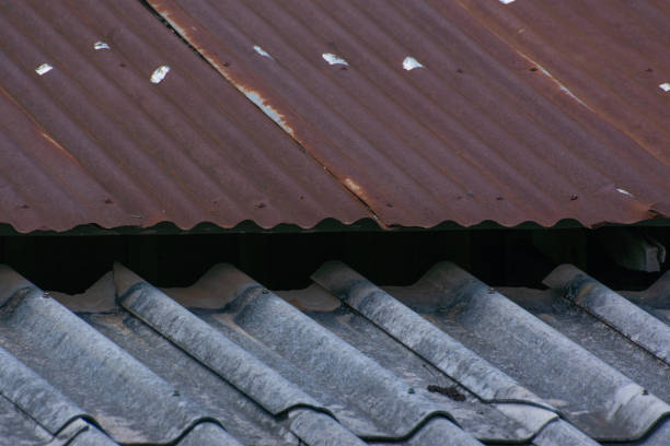 istock Gray tile roof differences And the old zinc roof rusted 1160993412
