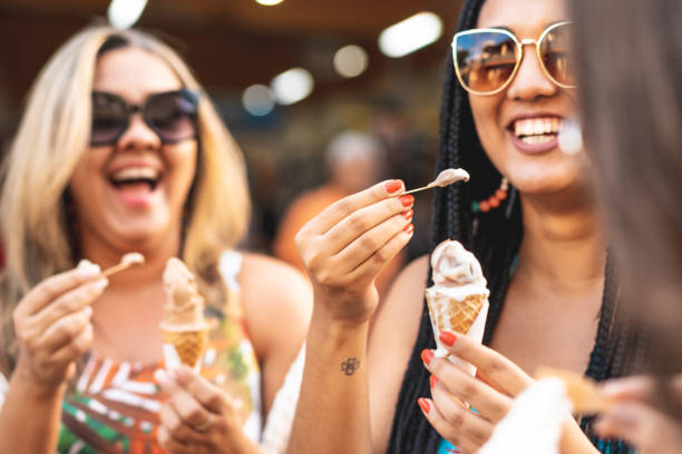 istock Women eating ice cream 1160996415