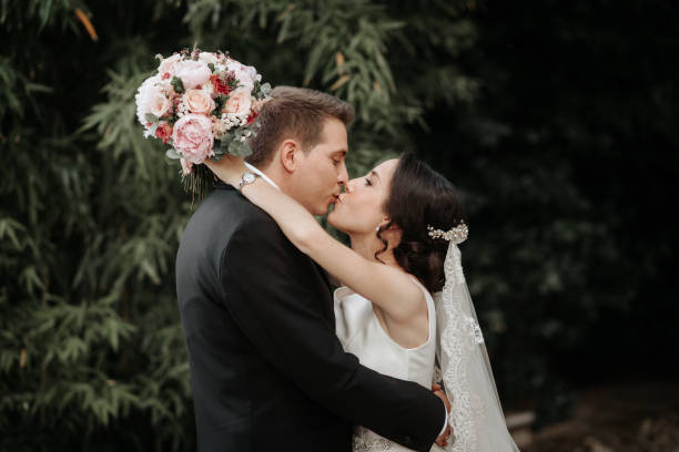 istock Wedding pair hugging and kissing. Walk and kissing. 1160996583