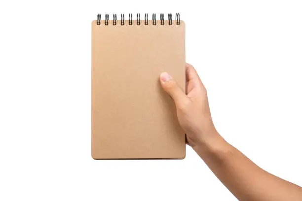 Close up of open brown blank notebook with ring loop binding. Empty wire-o brown notebook holding with two hand for business and education for write and note.