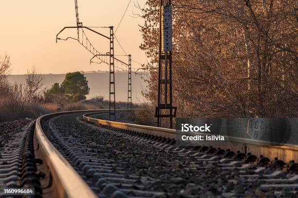 Unique Railroad Line At The Sunset Train Railway Track Low Clouds Over The Railroad Stock Photo - Download Image Now