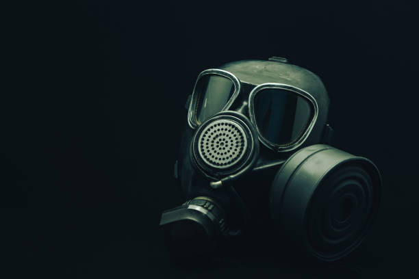 istock Gas mask on a black table and dark background. 1160996852