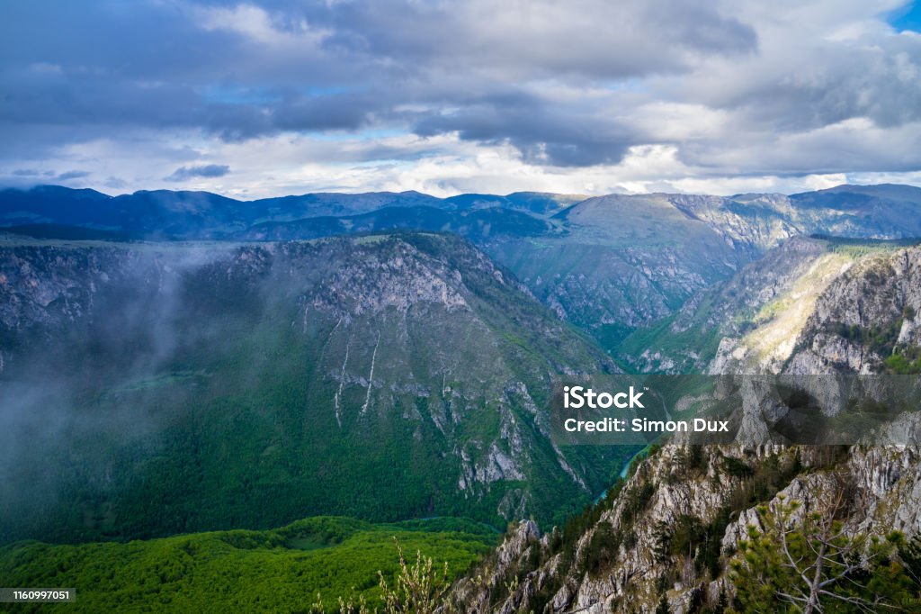 Montenegro, Spectacular tara river canyon nature landscape from peak of mountain curevac in dawning atmosphere in durmitor national park near zabljak Atmospheric Mood Stock Photo