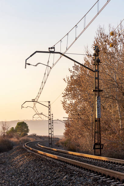 istock Unique railroad line at the sunset. Train railway track . Low clouds over the railroad. 1160997806