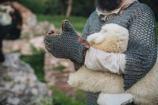 Keeping yourself warm during winter Man preparing his warm medieval coat chain mail stock pictures, royalty-free photos & images