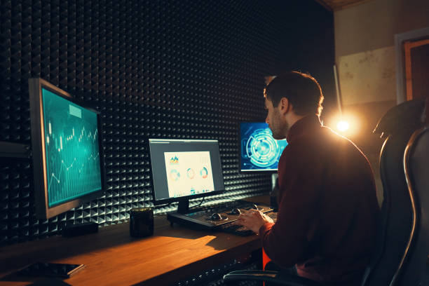 istock Male Videographer Edits and Cuts Footage and Sound on His Personal Computer 1160999862