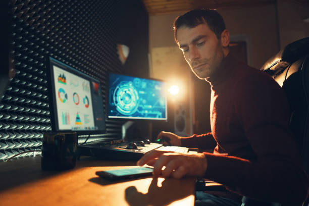 istock Male Videographer Edits and Cuts Footage and Sound on His Personal Computer 1160999865