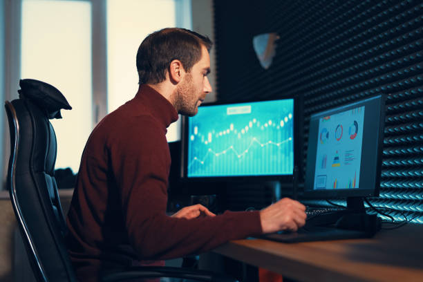 istock Male Videographer Edits and Cuts Footage and Sound on His Personal Computer 1160999876