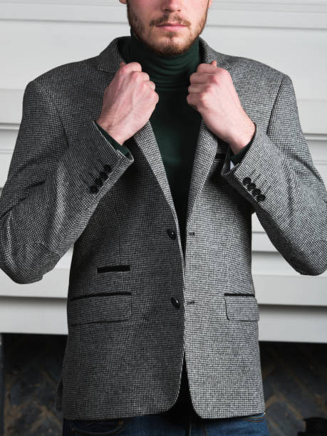 istock Handsome stylish young man standing in interior on white background 1161000785