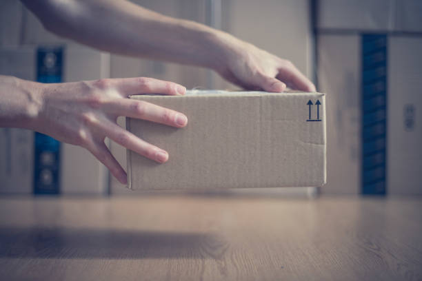 istock Cardboard box package, shipping concept: Delivering a parcel 1161001957
