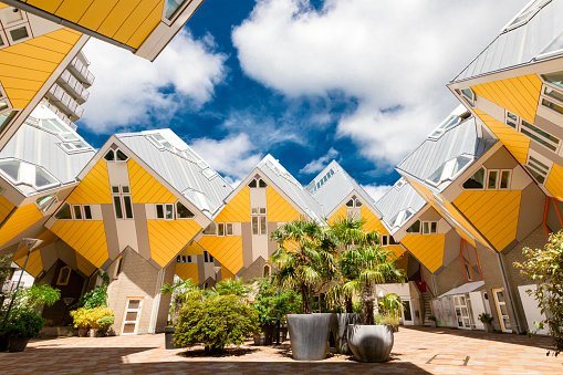 Rotterdam, The Netherlands - july 2019:Yellow Cube houses in Rotterdam under Blue Sky in Summer Sunny Daytime