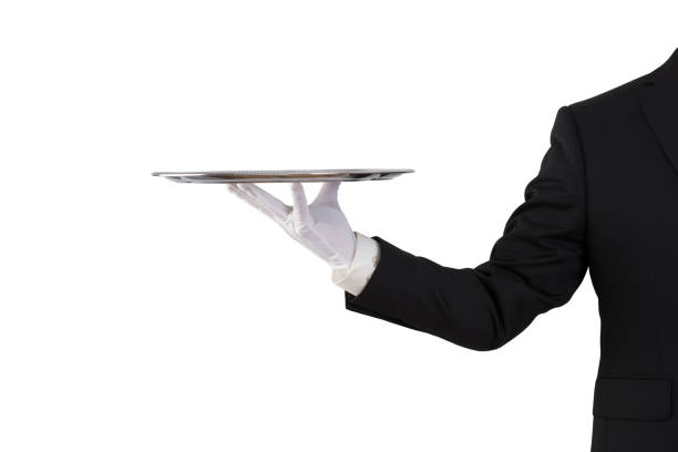 istock Waiter holding empty silver tray isolated on white background 1161003788