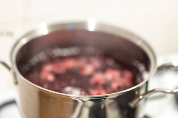 istock Blurred abstract background of blueberries boiling in a pan. 1161007797
