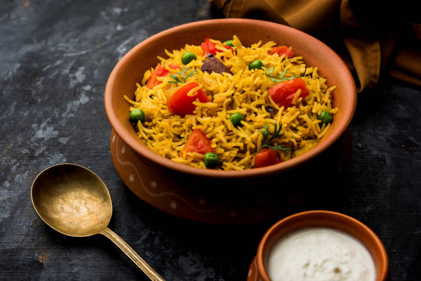 istock Tomato  pulav/Pilaf made using basmati rice, served in a bowl. selective focus 1161008309