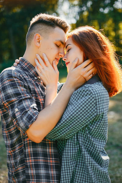istock Beautiful couple spend time in a summer park 1161011176
