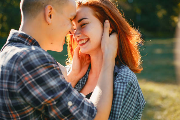 istock Beautiful couple spend time in a summer park 1161011188