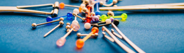 istock Body piercing background jewelry rings puncturing implants | Blurry Background 1161011326