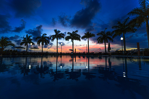 sunset over a pool, residential community - south florida