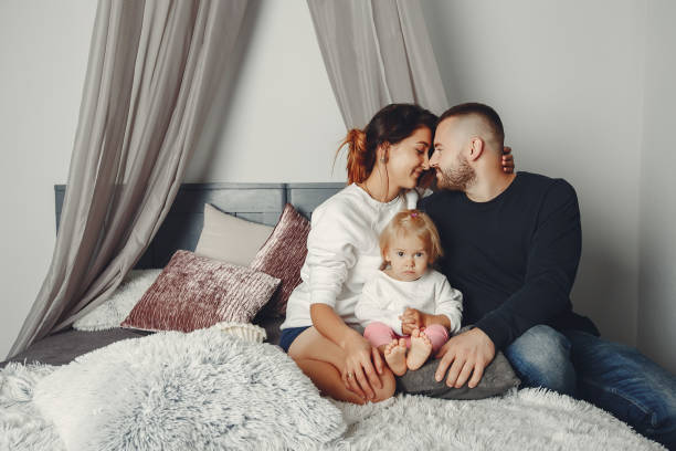istock Father and mother with little daughter 1161013678