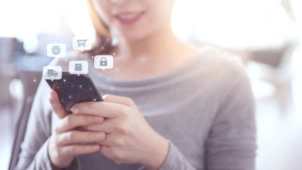 istock Close up hands using mobile smart phone with icon Online shopping, E-Commerce. 1161014628