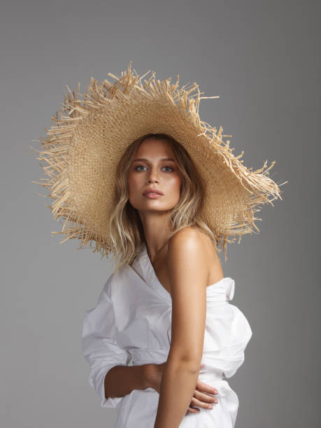 Beautiful woman wearing straw hat stock photo