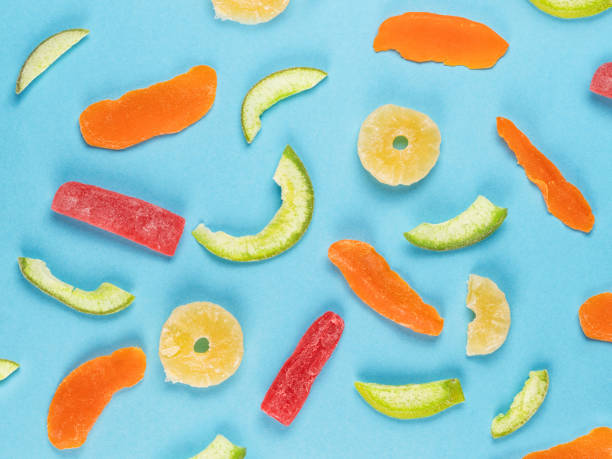 istock Different candied fruits on blue flat lay 1161016573