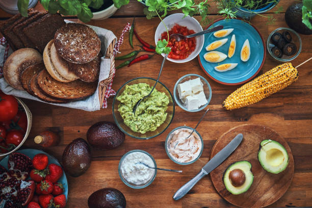 istock Preparing Avocado Sandwich with Tomato and Feta Cheese 1161016635