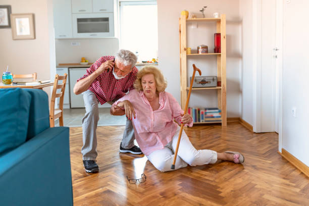 istock Senior wife sitting on floor while retired husband talking on smartphone 1161017036
