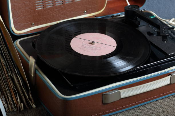 istock An old gramophone with a vinyl record mounted on it. 1161017768