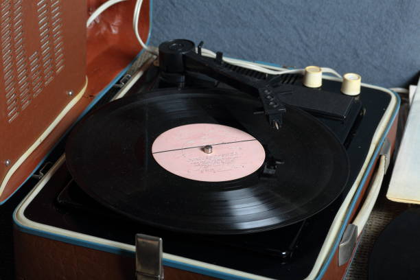istock An old gramophone with a vinyl record mounted on it. 1161017797