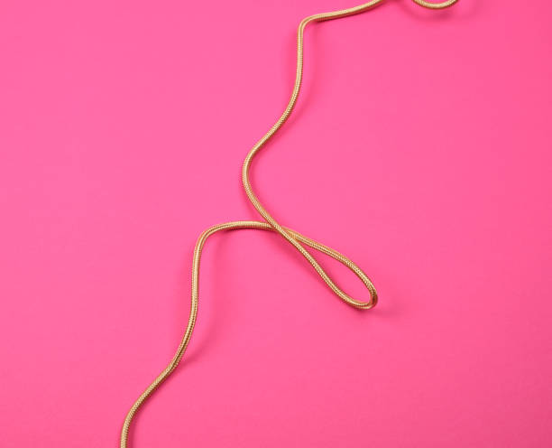 istock twisted golden cable for equipment in textile winding 1161018373