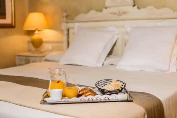 istock Tray with healthy breakfast food on bed 1161020816